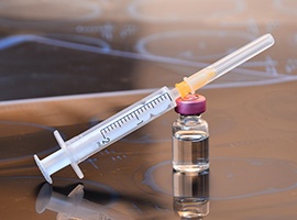 Close-up of syringe and small vial of BOTOX