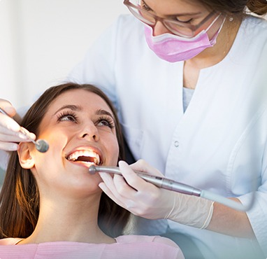 Comfortable woman receiving dental treatment